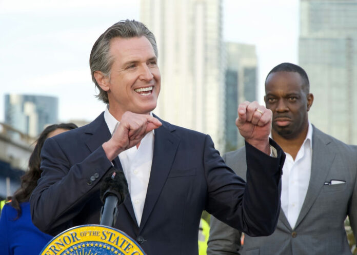 2387585363 Smiling man giving a speech at an outdoor event.
