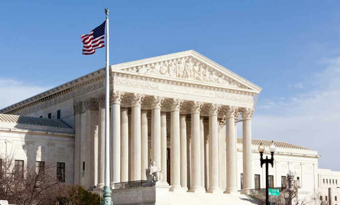 96721225 United States Supreme Court building with American flag.