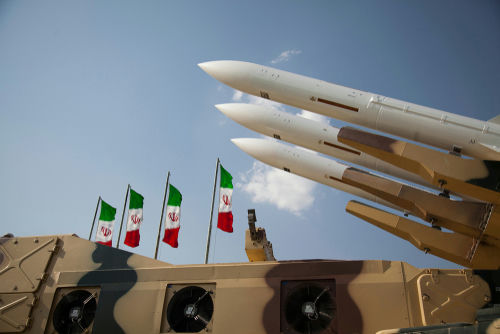 shutterstock1621002841-1jpg Military missiles displayed with Iranian flags in the background
