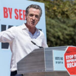 “New California” Warning Explodes In Virginia… Gavin Newsom speaking at a podium, Stop the Republican Recall.