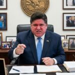 Illinois Plot Could DELAY Elections Statewide… A political leader in an office expressing strong emotions while seated at a desk