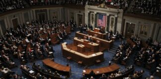 A large assembly of politicians in a legislative chamber