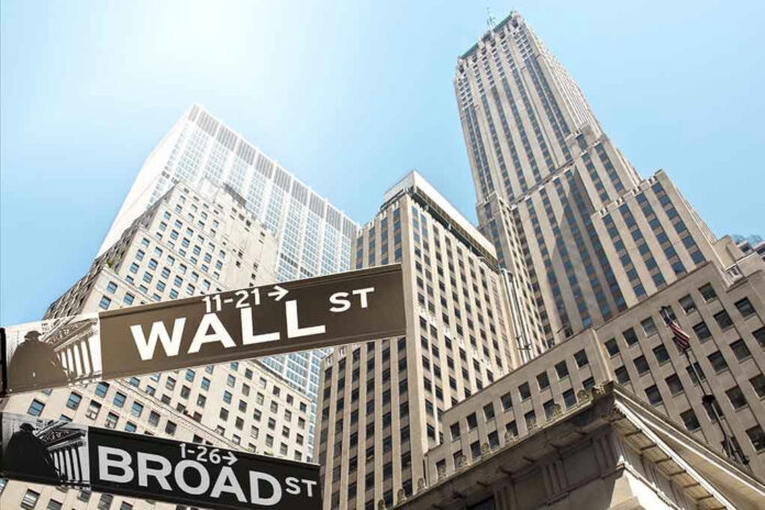 156562427 Wall Street and Broad Street signs, skyscrapers in background.