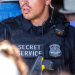 Texas Felon FIRES at Secret Service—Chilling Demand… Secret Service officer wearing tactical gear and radio.