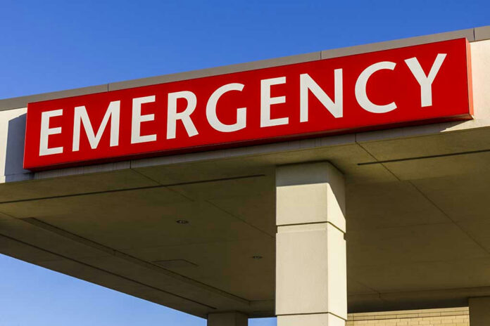 545172235 Red and white Emergency sign outside building.