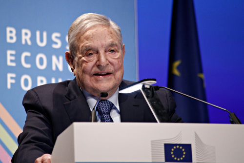 shutterstock1039128112-1jpg Older man speaking at a podium during an economic forum