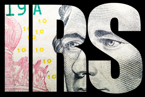 shutterstock_786086002.jpg Close-up of a banknote featuring the letters IRS