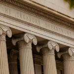 Citizenship Checks Hit Banks Next The Treasury Department building with columns and architectural details.