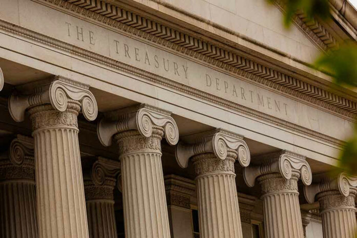 1548453638 The Treasury Department building with columns and architectural details.