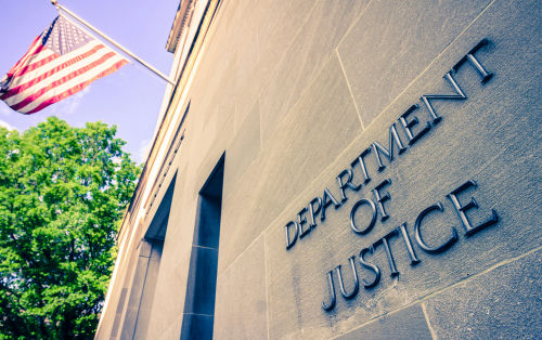 shutterstock1384089728-1jpg-1 Department of Justice building with American flag.