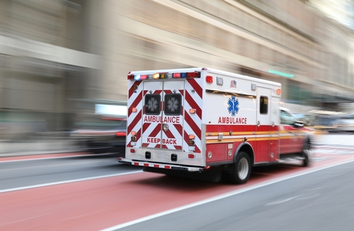 Ambulance,On,Emergency,Vehicle,In,Motion,Blur An ambulance speeding down a city street with lights flashing