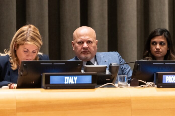 Icc,Prosecutor,Karim,Khan,Attends,Commemoration,Of,The,25th,Anniversary Panel of officials seated at a conference table