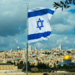 Israel Scores Major Diplomatic Win Israeli flag waving in front of the Jerusalem skyline with a golden dome in view