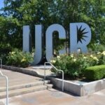 Taxpayer-Funded Aid Sparks New Debate UCR sign sculpture by landscaped flower beds and trees