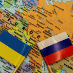 Independence Day Call Sparks Ukraine Jitters Ukrainian and Russian flags on map of Europe.