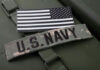 U.S. Navy Faces Fresh Readiness Scrutiny U.S. Navy patch and monochrome American flag patch.