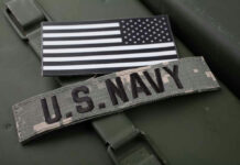 U.S. Navy Faces Fresh Readiness Scrutiny U.S. Navy patch and monochrome American flag patch.