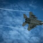 Iran Ceasefire Collapses After Strait Attacks Jet fighter flying through a cloudy blue sky leaving vapor trails