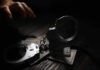Livestream Murder Shocks Court Handcuffs on cash with a reaching hand in low light