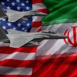 U.S. Hits 80+ Iranian Targets After Tanker Attacks Armed security team on a ship deck overlooking a large tanker at sea