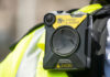 Accountability Theater At ICE Body-worn camera attached to a high-visibility vest
