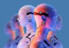 Row of humanoid robots in profile with neon lighting against a blue background