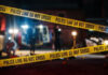 Deputy U.S. Marshal Killed Serving Warrant Yellow police tape at a nighttime crime scene.