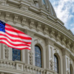 SAVE Act Faces Another Senate Test US flag waving in front of Capitol building.