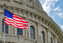 SAVE Act Faces Another Senate Test US flag waving in front of Capitol building.