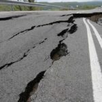 Massive Mexico Quake Sparks Tsunami Alert Asphalt road with deep cracks and collapse