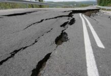 Massive Mexico Quake Sparks Tsunami Alert Asphalt road with deep cracks and collapse