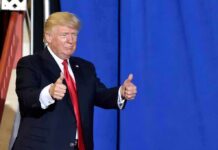 Dinner Returns Following April Shooting man in suit giving two thumbs up