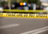 Parking Dispute Ends In Triple Murder Police tape cordons off a street