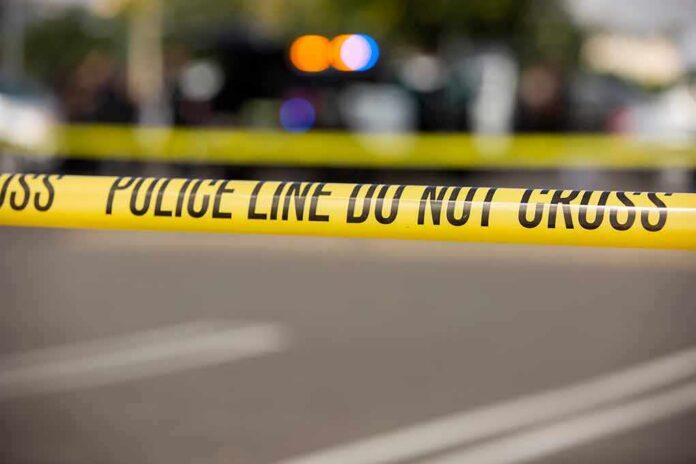 shutterstock_1650478828 Police tape cordons off a street