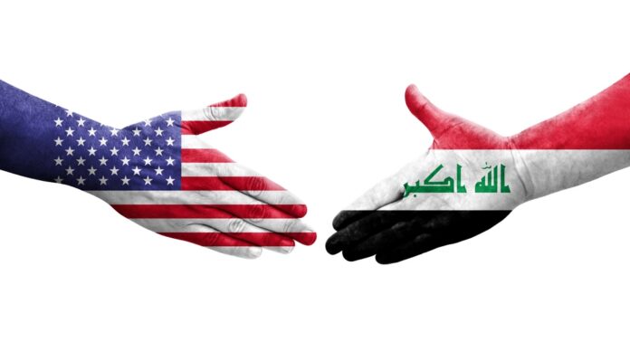 Handshake,Between,Iraq,And,Usa,Flags,Painted,On,Hands,,Isolated