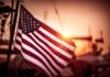 U.S. Identifies Fourth Soldier Lost In Jordan American flag waving at sunset