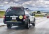 Sheriff SUV patrolling a highway.