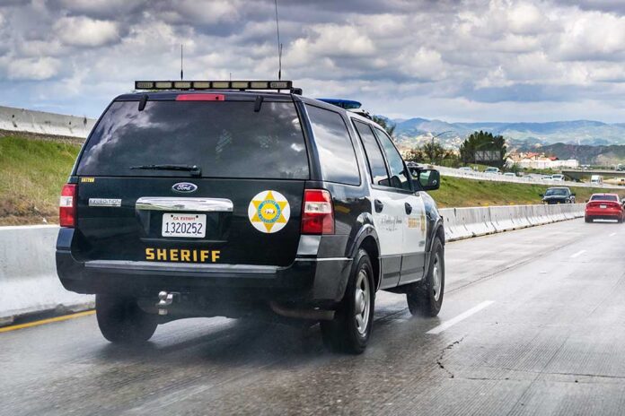 Sheriff SUV patrolling a highway.