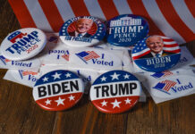 Biden and Trump campaign buttons with "I Voted" stickers.