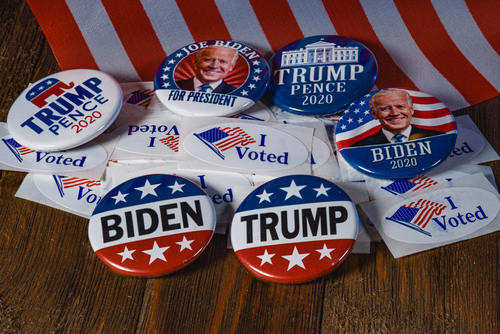 Biden and Trump campaign buttons with "I Voted" stickers.