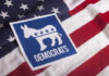 Democratic Party symbol on American flag background.