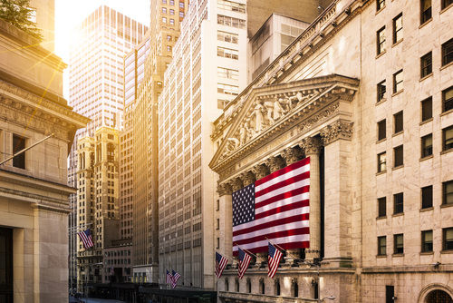 New York Stock Exchange building with American flag.